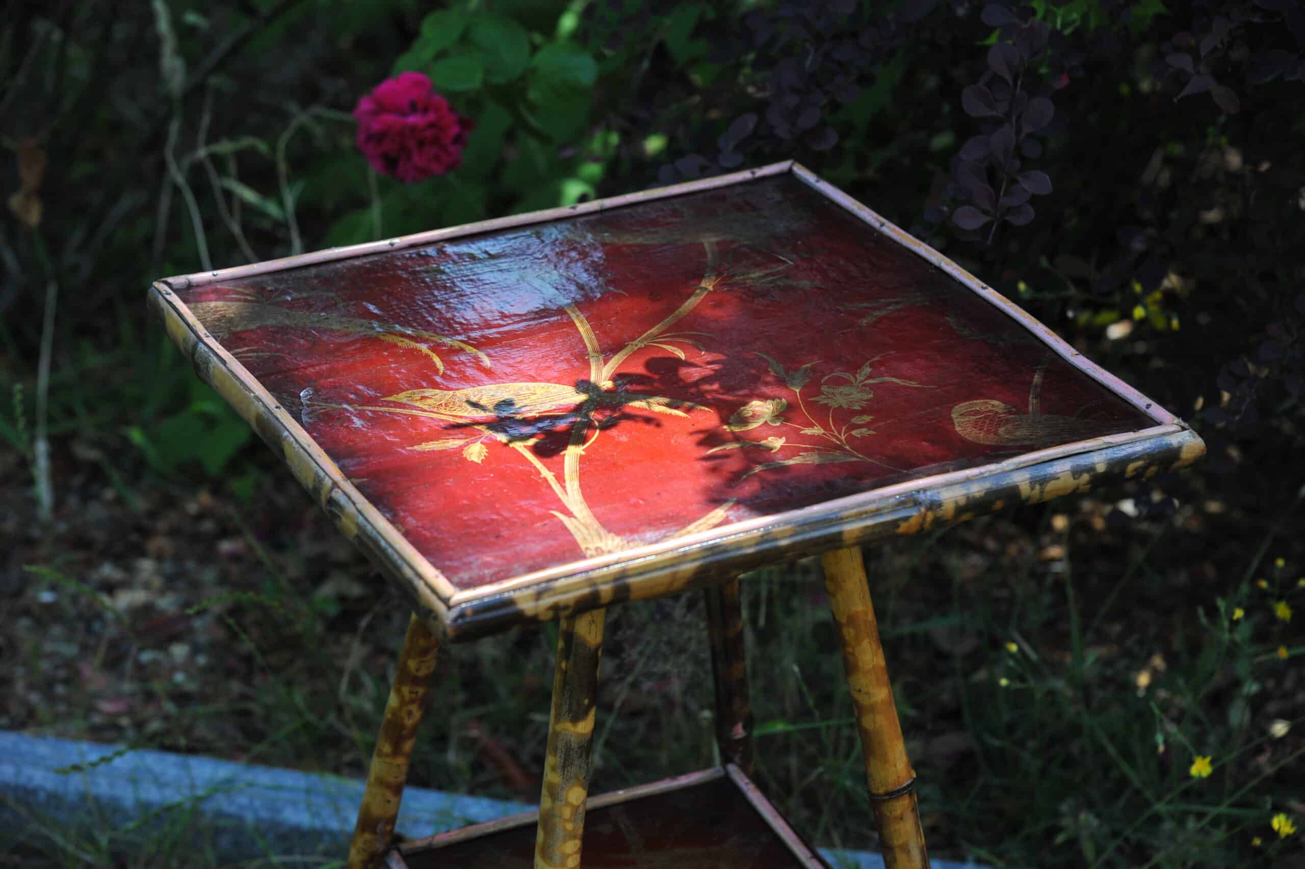 a good antique vintage two tier bamboo and lacquered panel side table