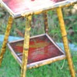 a good antique vintage two tier bamboo and lacquered panel side table