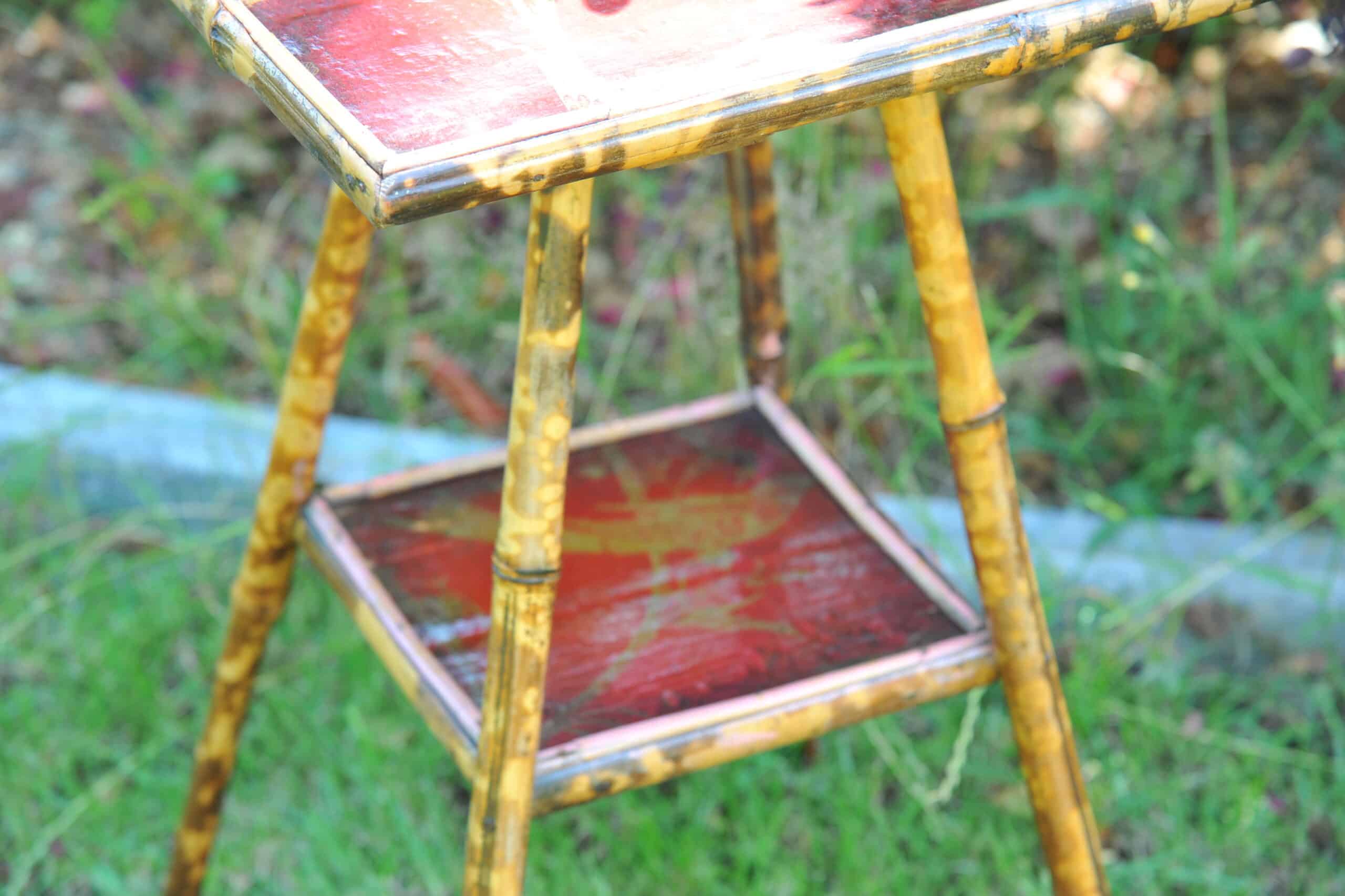 a good antique vintage two tier bamboo and lacquered panel side table