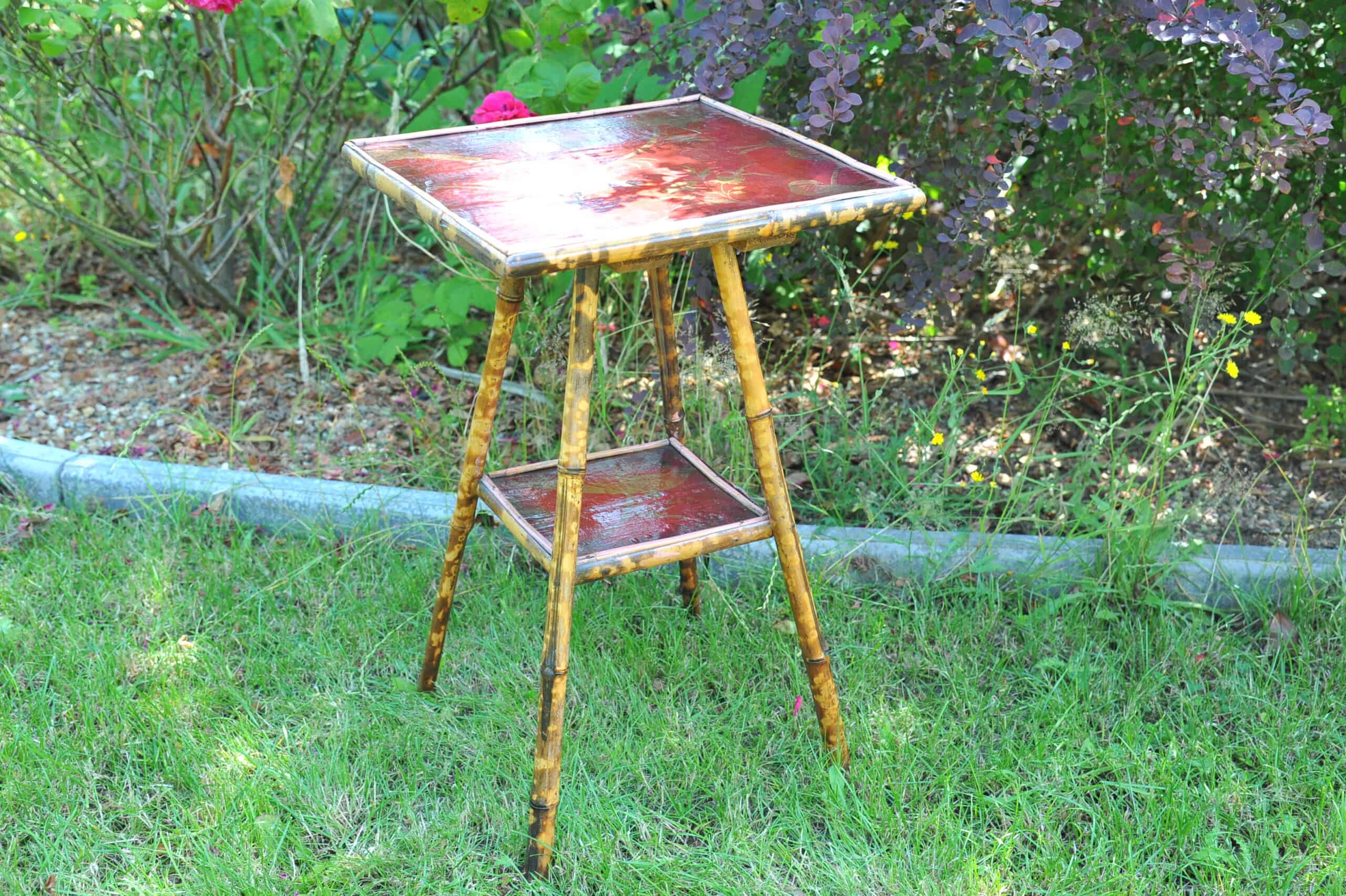 a good antique vintage two tier bamboo and lacquered panel side table