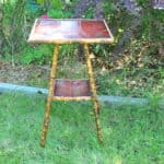 a good antique vintage two tier bamboo and lacquered panel side table