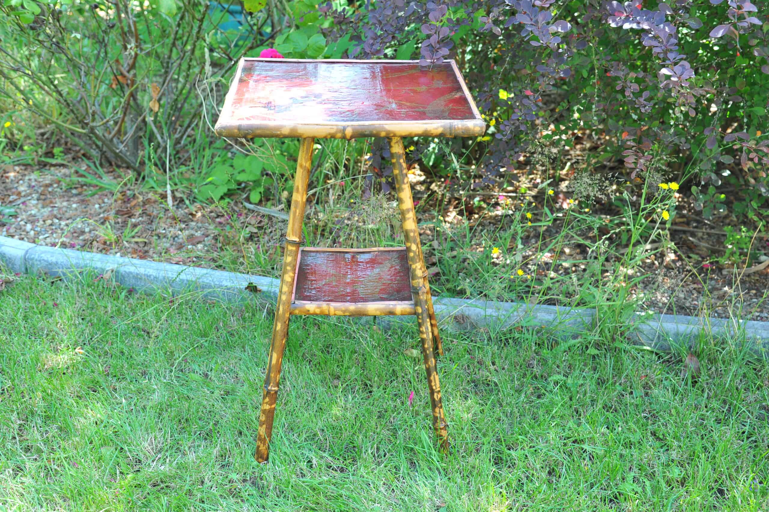 a good antique vintage two tier bamboo and lacquered panel side table