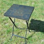 a vintage chinoiseries top metal folding table