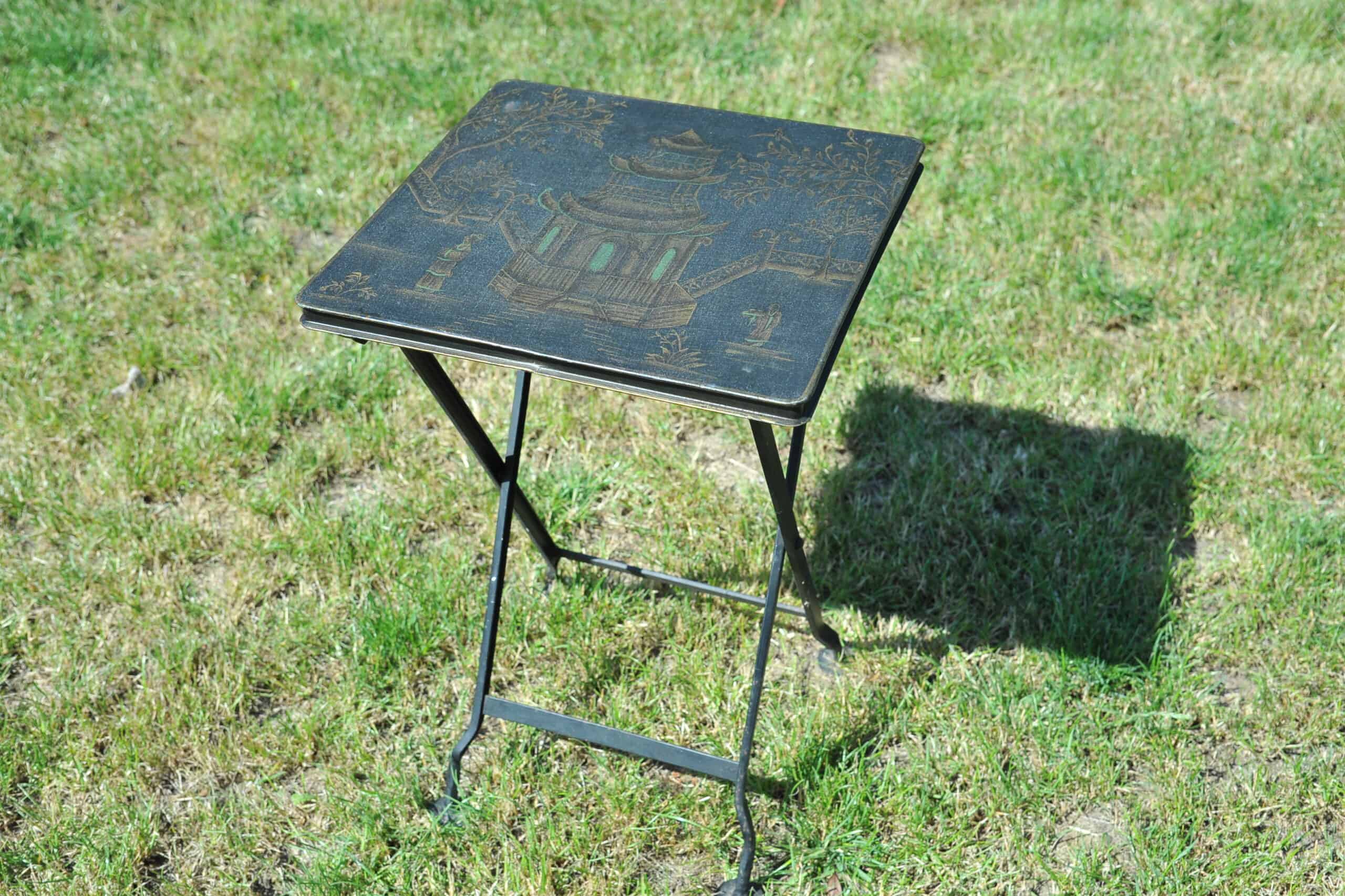 a vintage chinoiseries top metal folding table