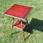 a good antique vintage two tier bamboo and lacquered panel side table