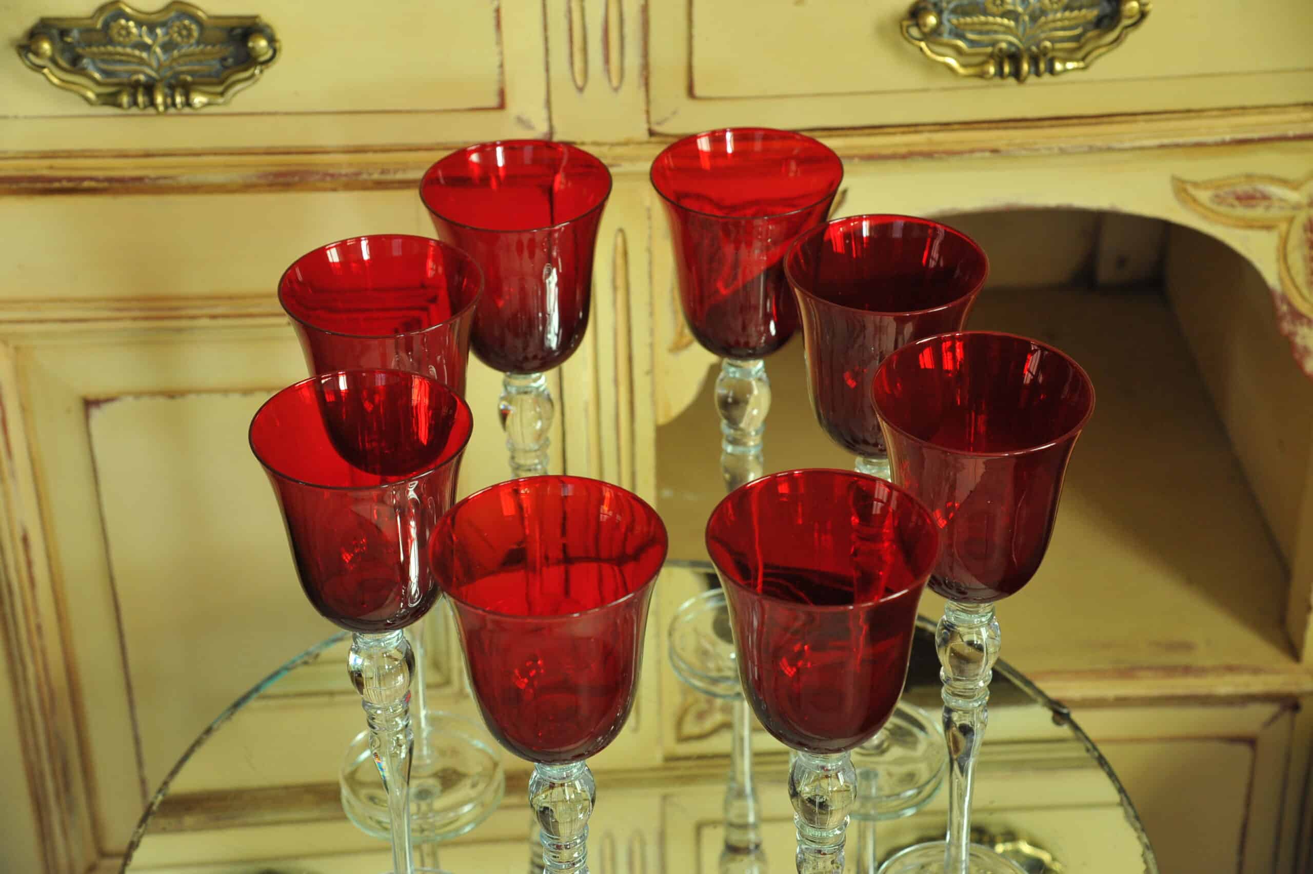 a luxury set of extremely large vintage ruby red wine glasses