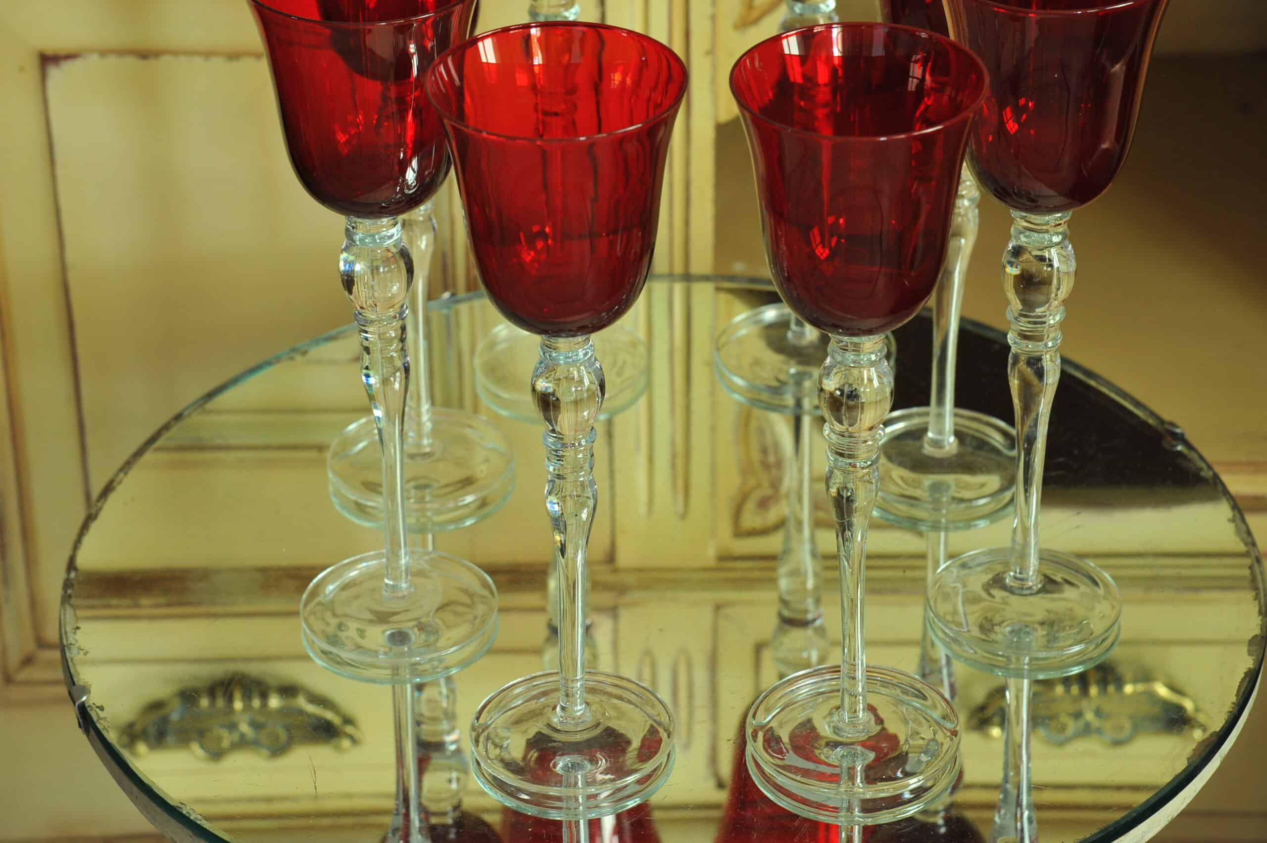 a luxury set of extremely large vintage ruby red wine glasses