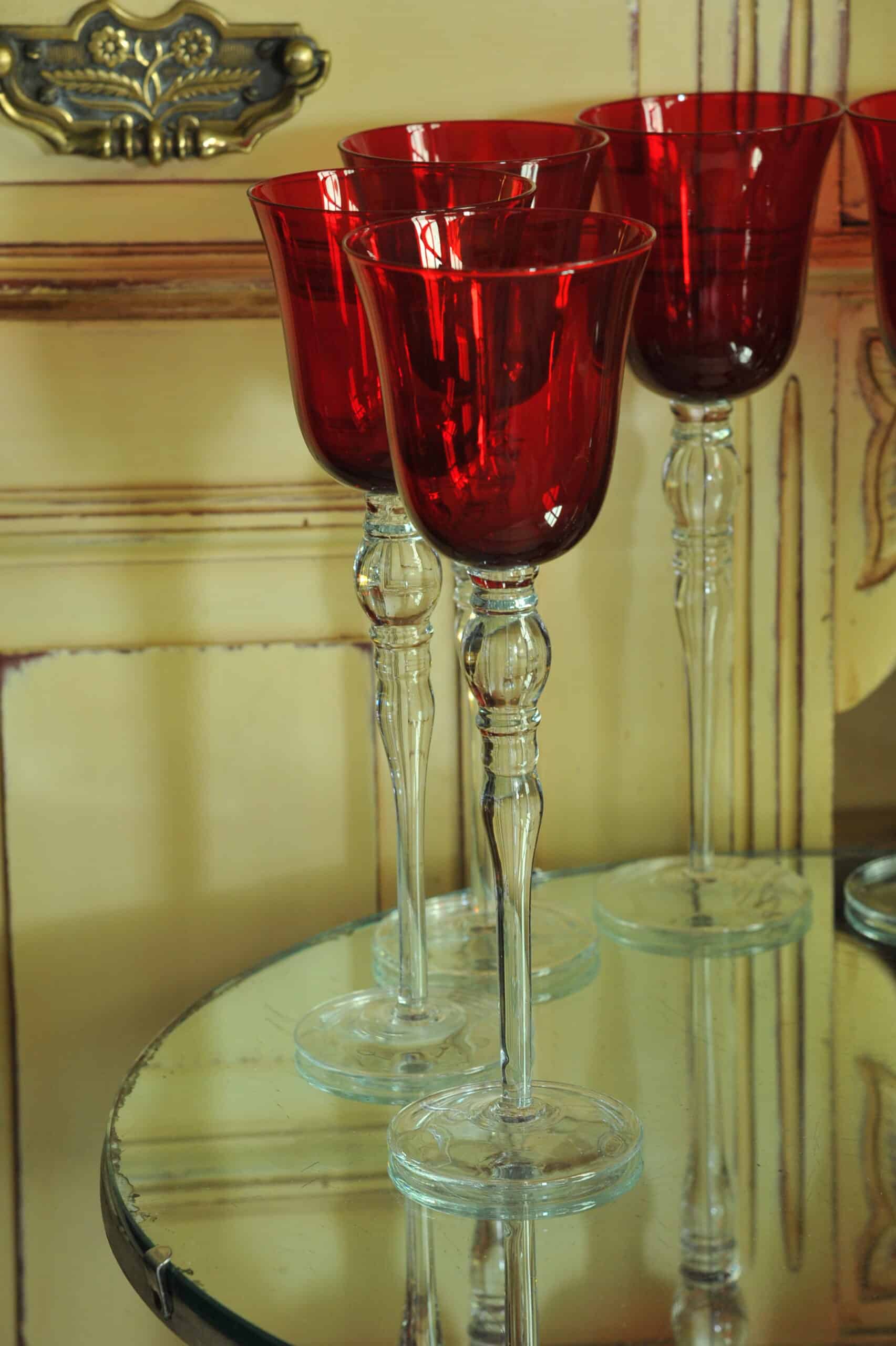 a luxury set of extremely large vintage ruby red wine glasses