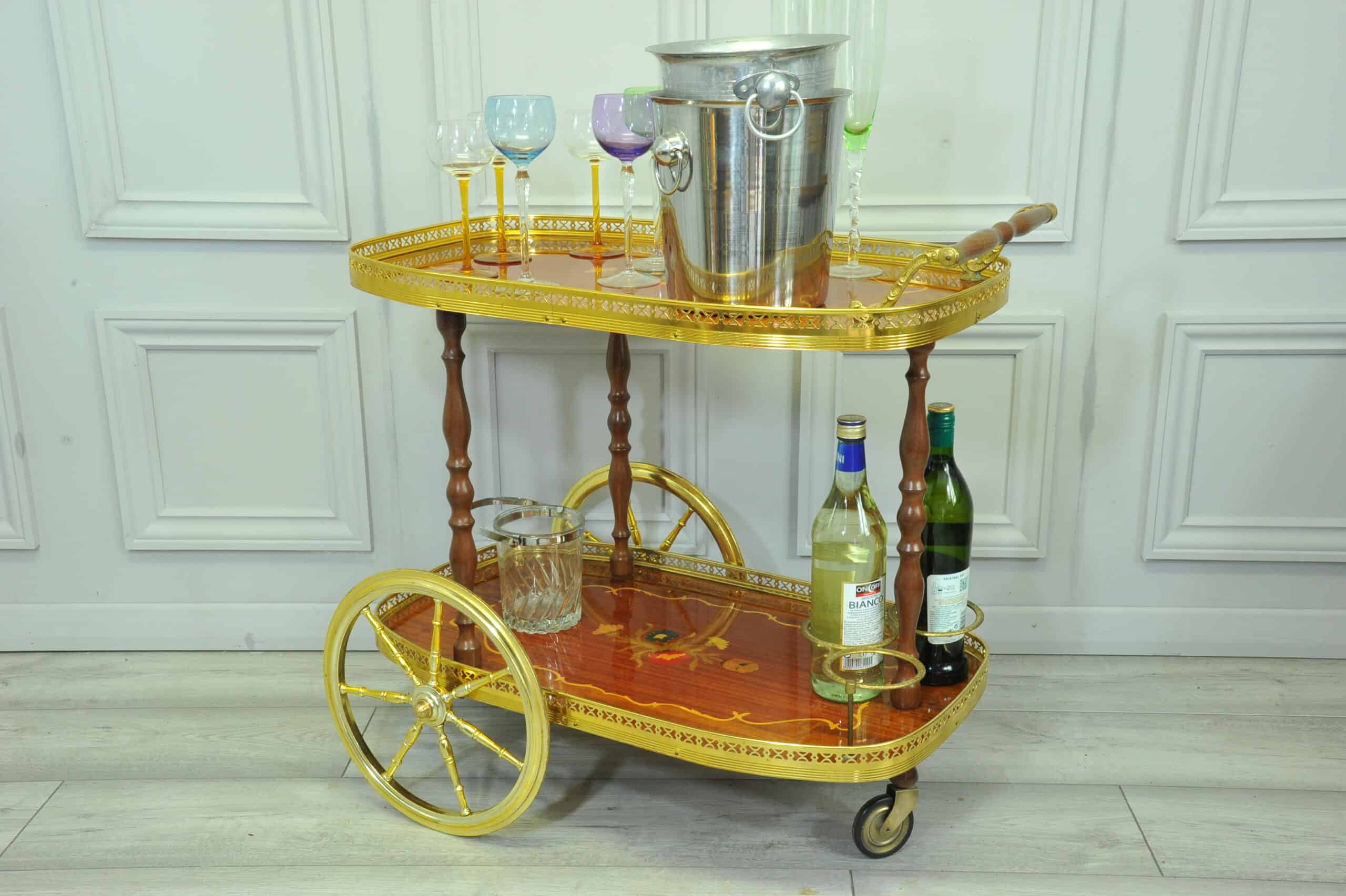 a vintage two tier brass and inlaid wood bar cart drinks trolley