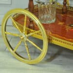 a vintage two tier brass and inlaid wood bar cart drinks trolley