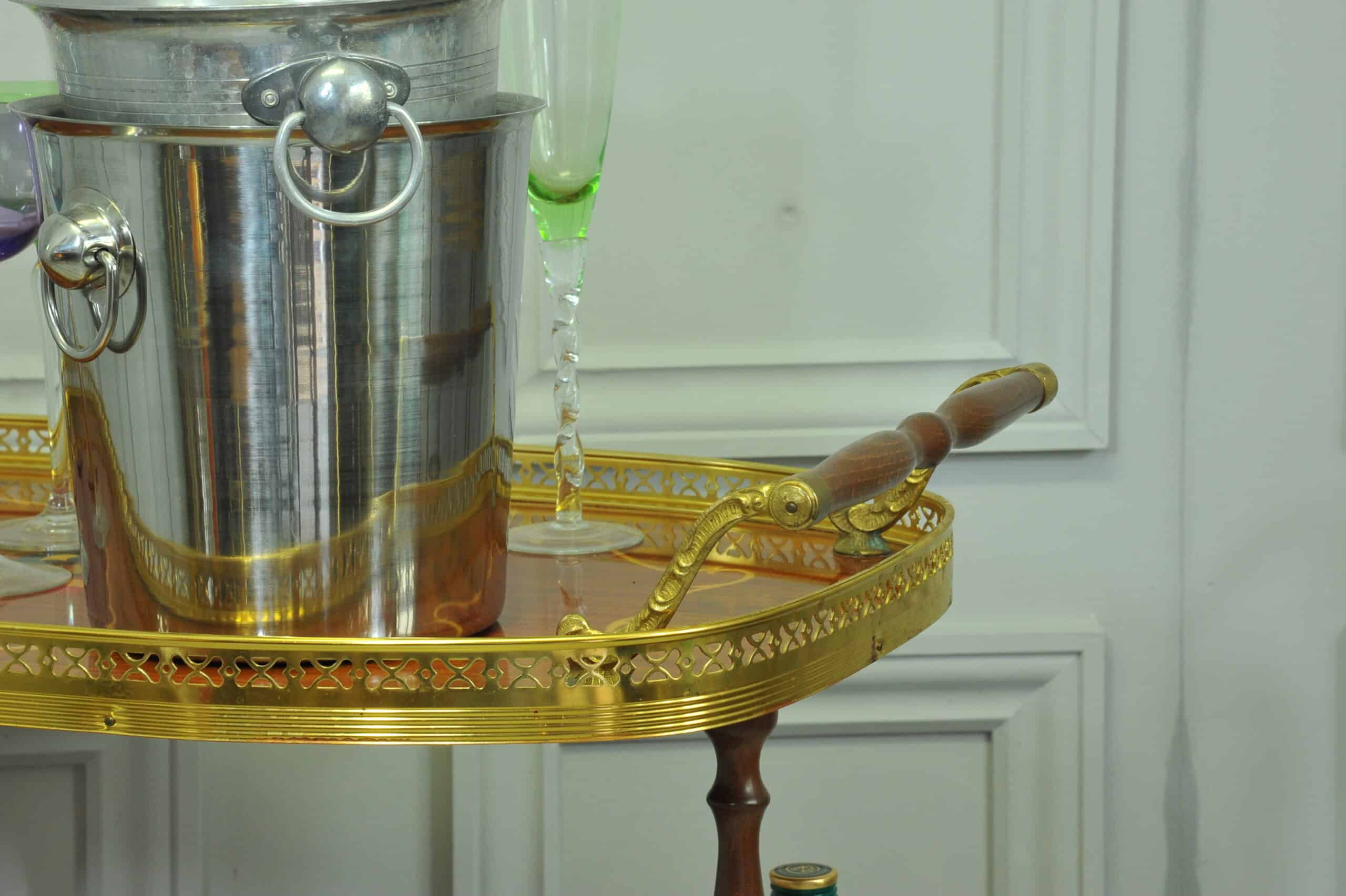 a vintage two tier brass and inlaid wood bar cart drinks trolley