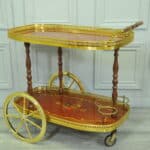 a vintage two tier brass and inlaid wood bar cart drinks trolley