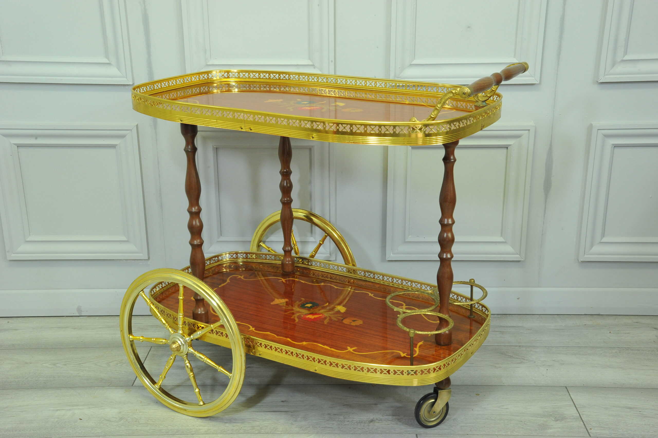 a vintage two tier brass and inlaid wood bar cart drinks trolley