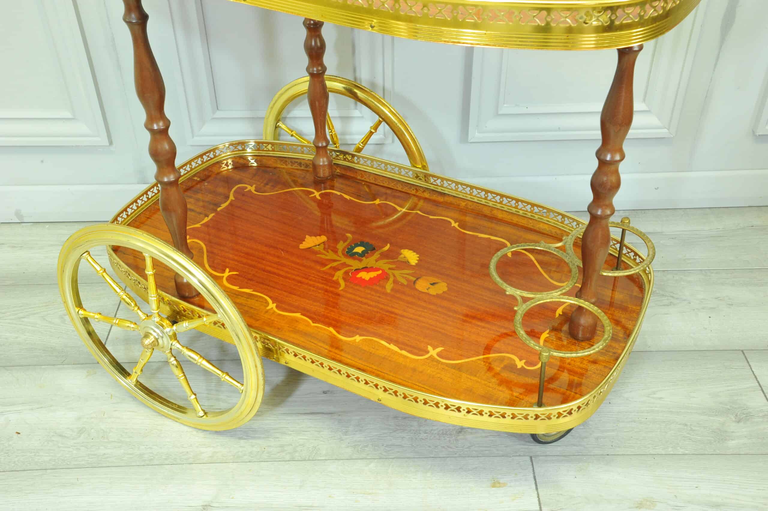 a vintage two tier brass and inlaid wood bar cart drinks trolley