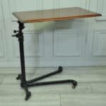 a good antique vintage cast iron and mahogany adjustable bed or side table