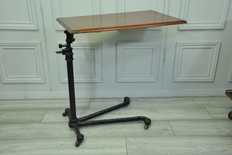 a good antique vintage cast iron and mahogany adjustable bed or side table