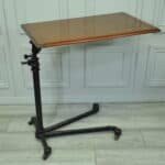 a good antique vintage cast iron and mahogany adjustable bed or side table