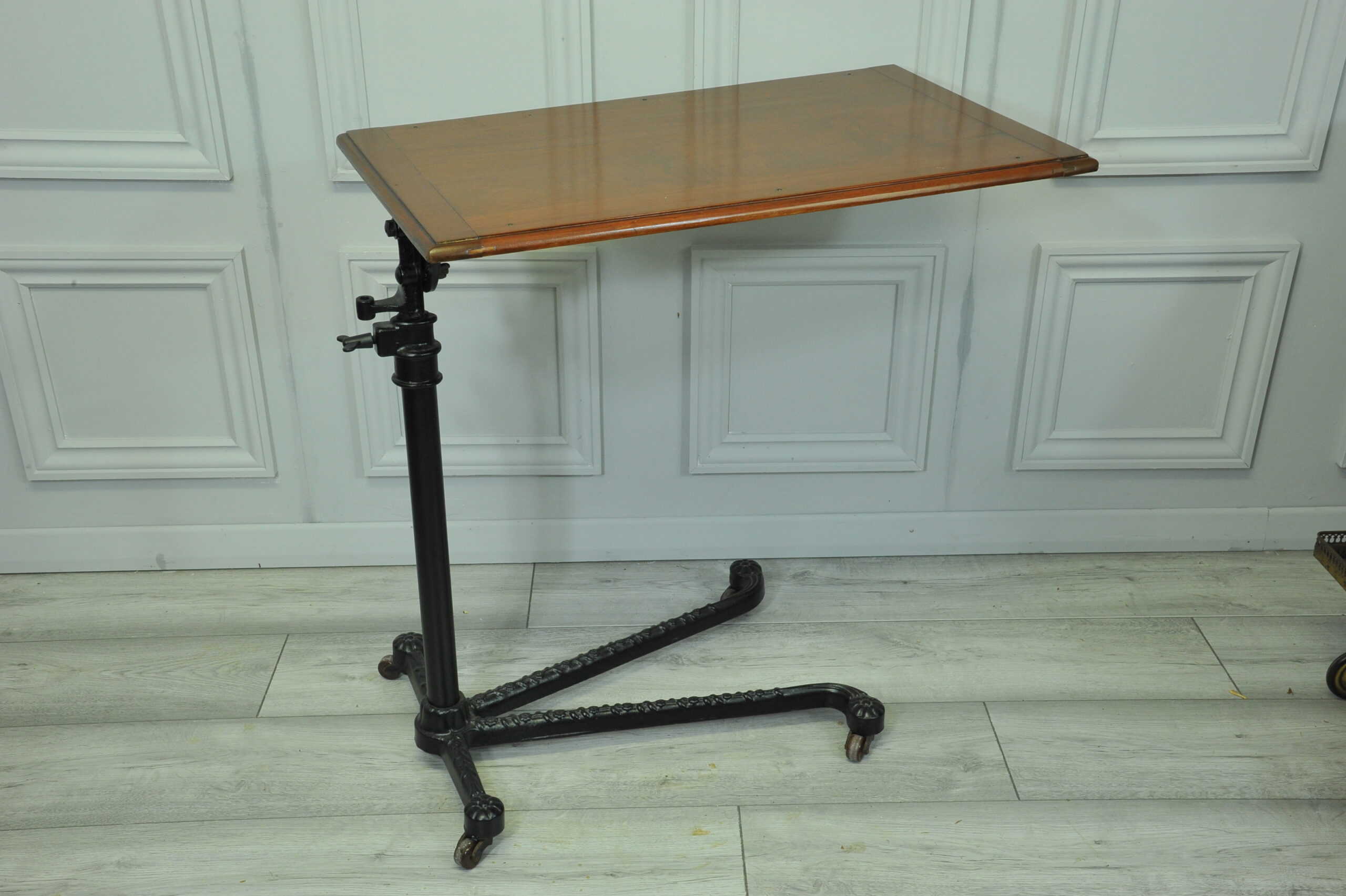 a good antique vintage cast iron and mahogany adjustable bed or side table