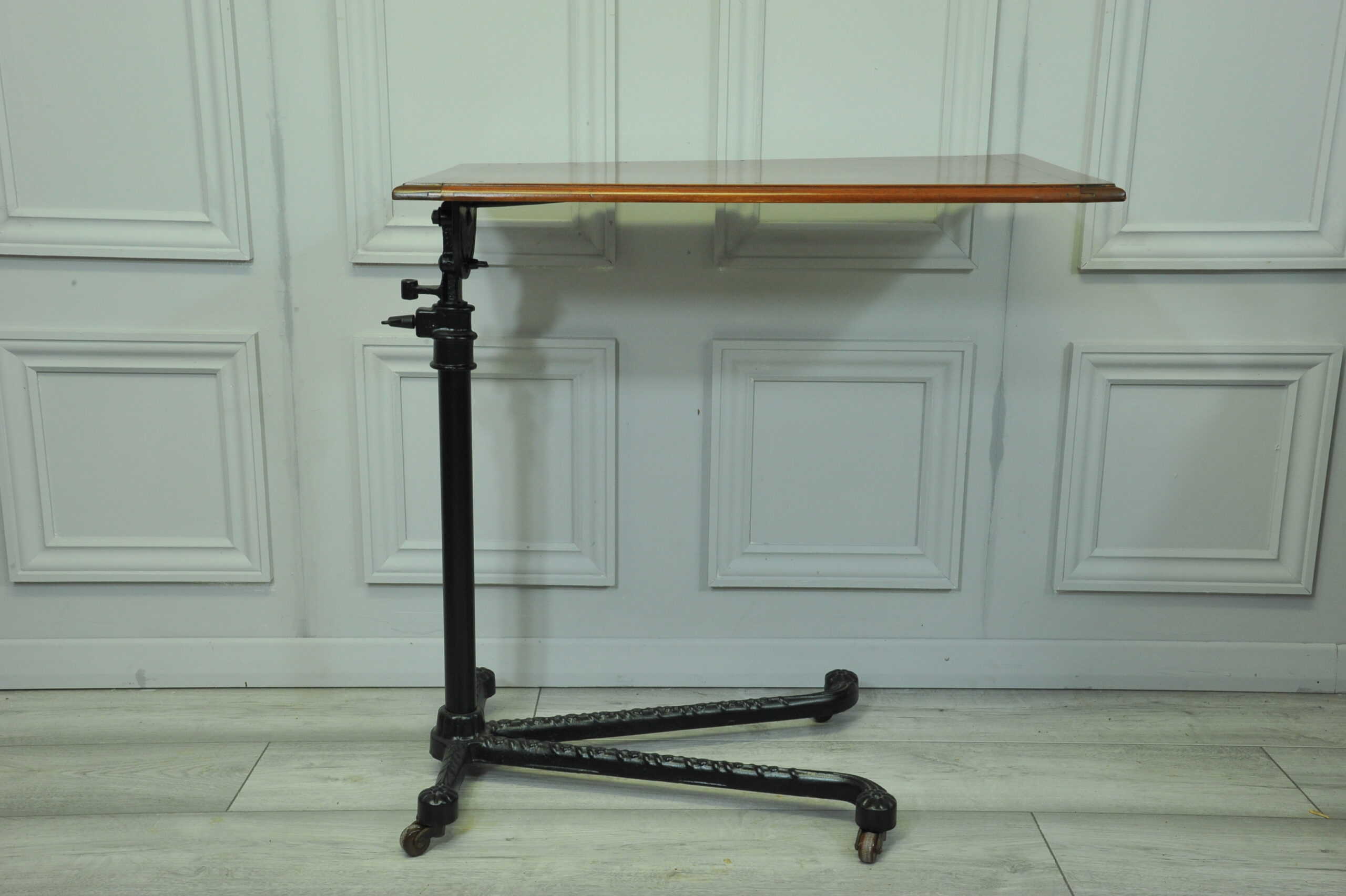 a good antique vintage cast iron and mahogany adjustable bed or side table