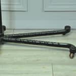 a good antique vintage cast iron and mahogany adjustable bed or side table