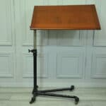a good antique vintage cast iron and mahogany adjustable bed or side table