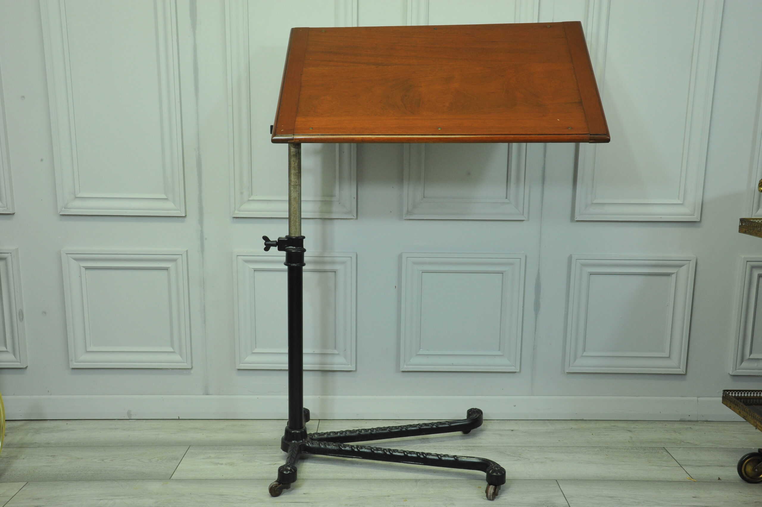 a good antique vintage cast iron and mahogany adjustable bed or side table