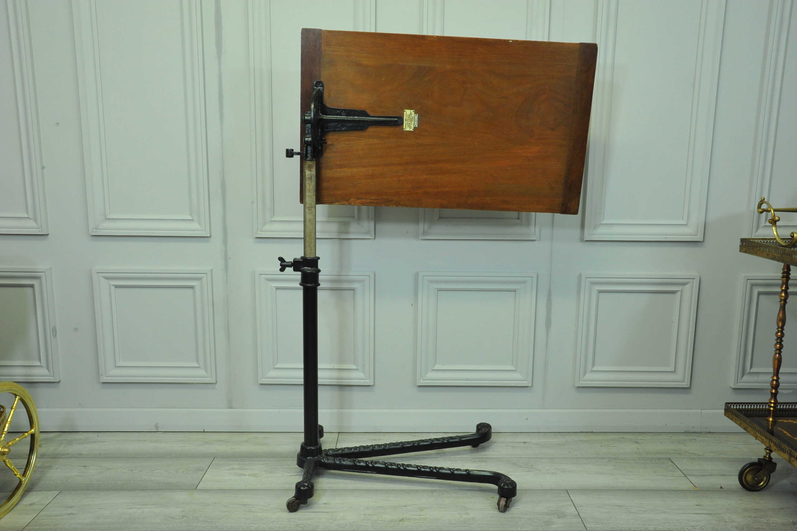 a good antique vintage cast iron and mahogany adjustable bed or side table