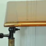 a good antique vintage cast iron and mahogany adjustable bed or side table