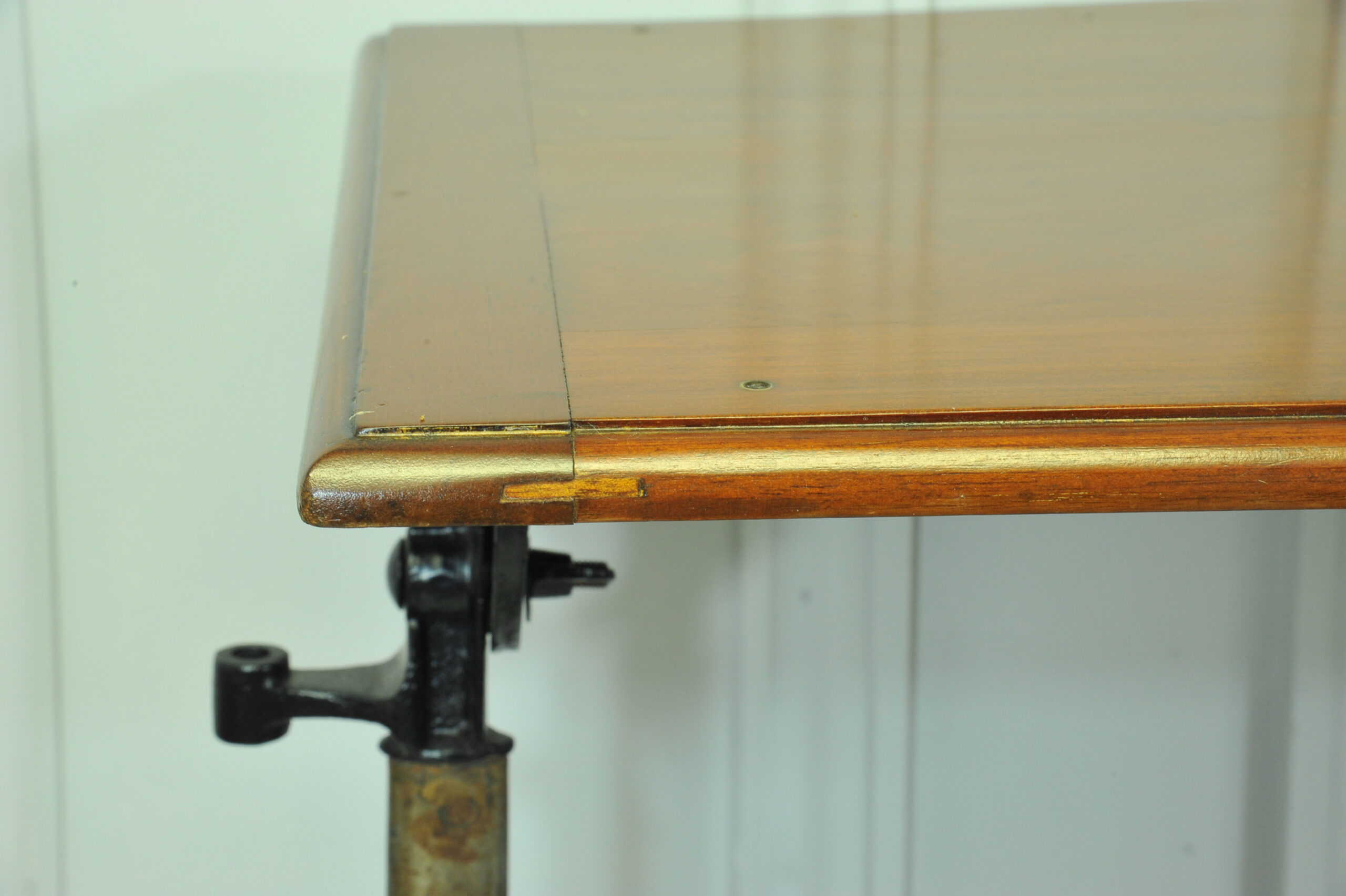a good antique vintage cast iron and mahogany adjustable bed or side table
