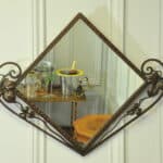 striking vintage wrought iron wall mirror