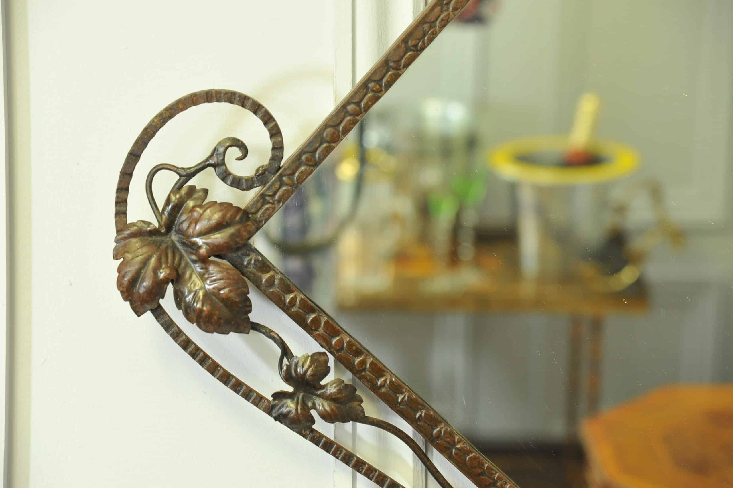 striking vintage wrought iron wall mirror