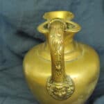 an antique brass greek trefoil oinochoe wine