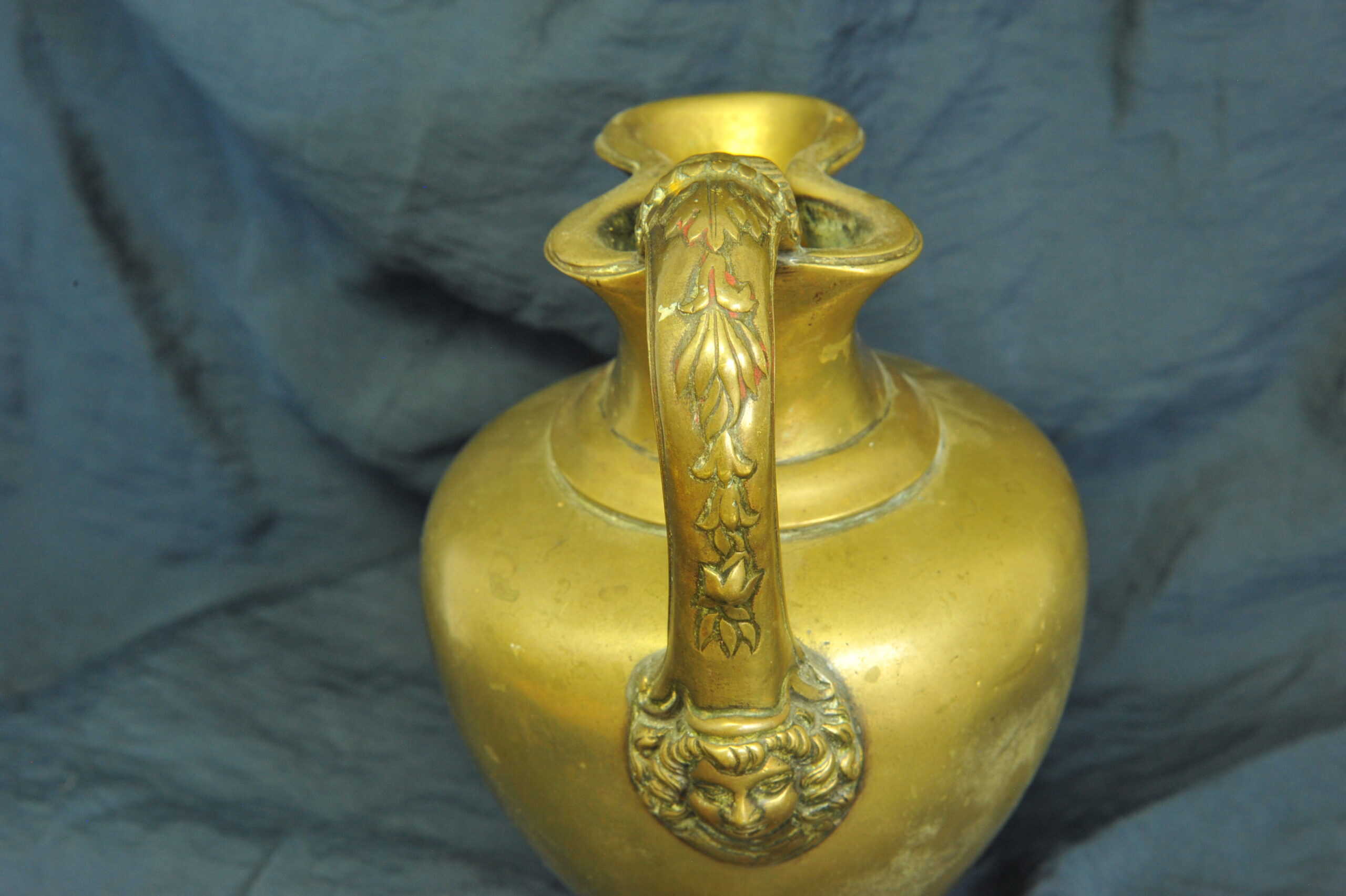an antique brass greek trefoil oinochoe wine
