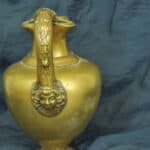 an antique brass greek trefoil oinochoe wine