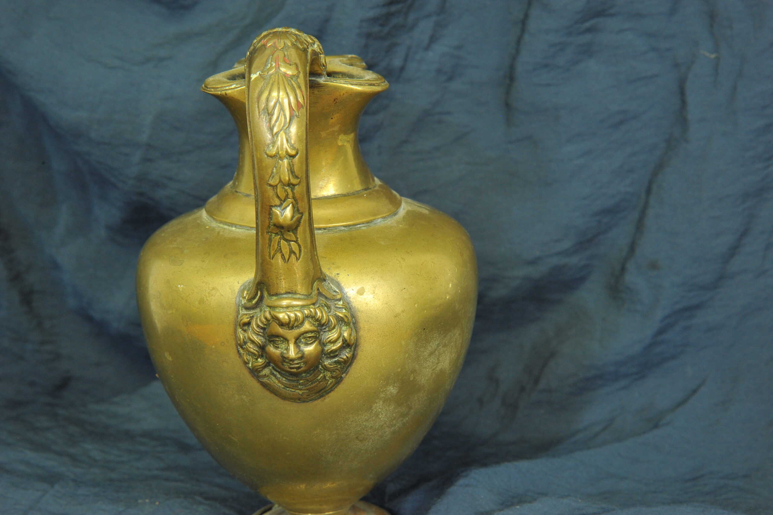 an antique brass greek trefoil oinochoe wine