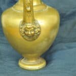 an antique brass greek trefoil oinochoe wine