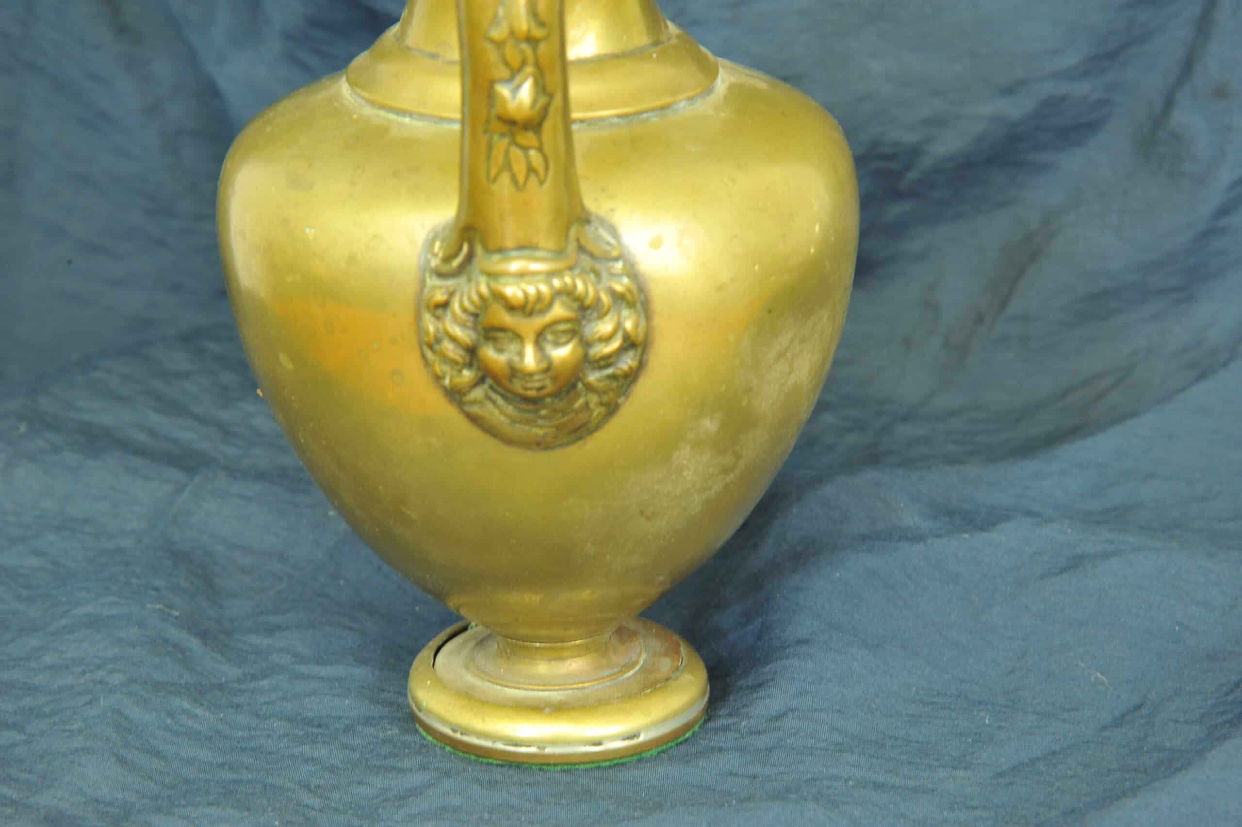 an antique brass greek trefoil oinochoe wine