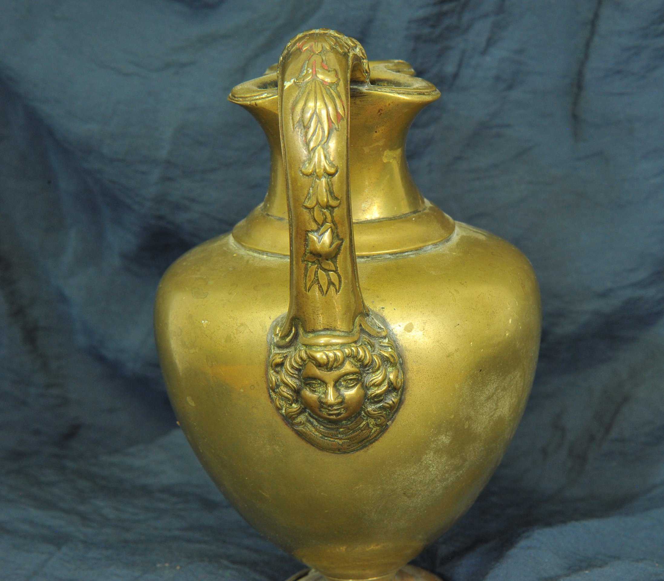 an antique brass greek trefoil oinochoe wine