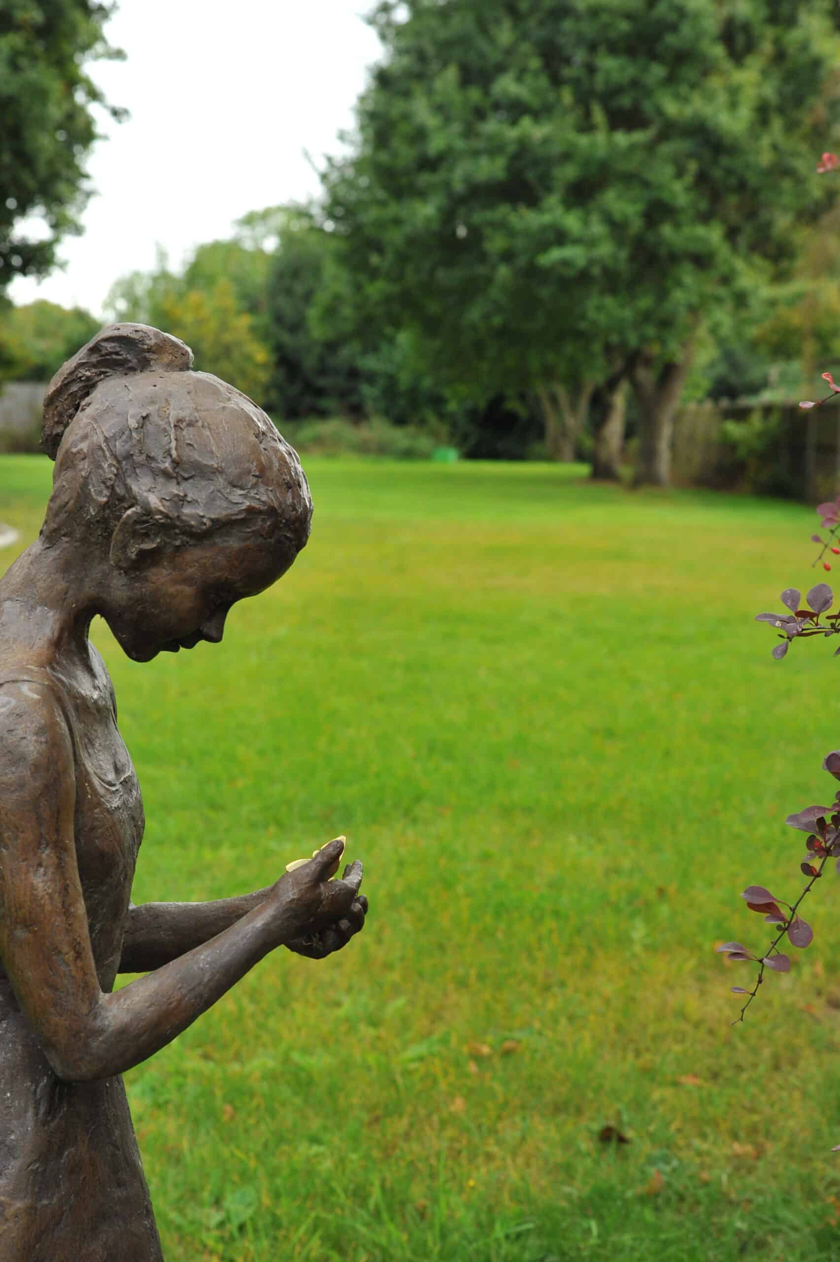 a stunning statue of a young girl