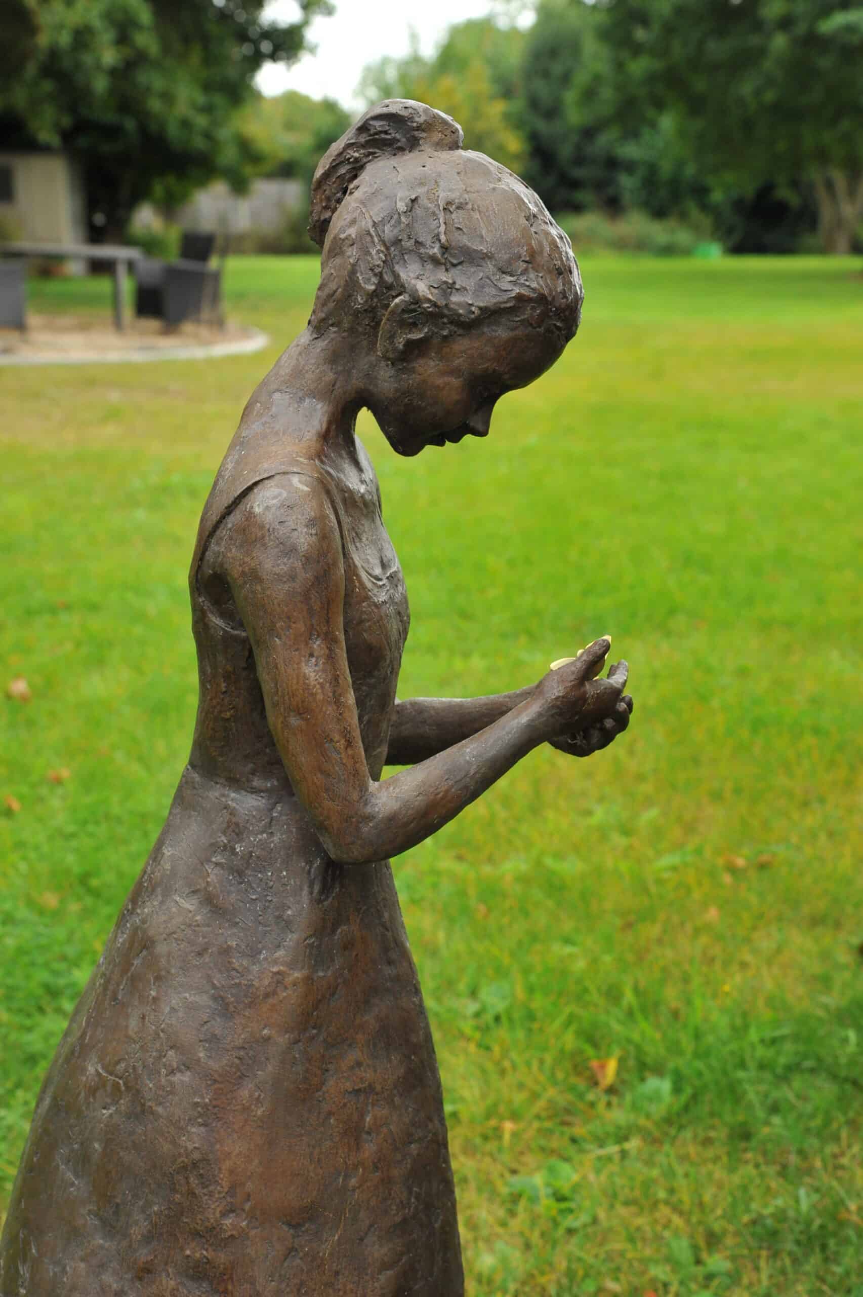 a stunning statue of a young girl