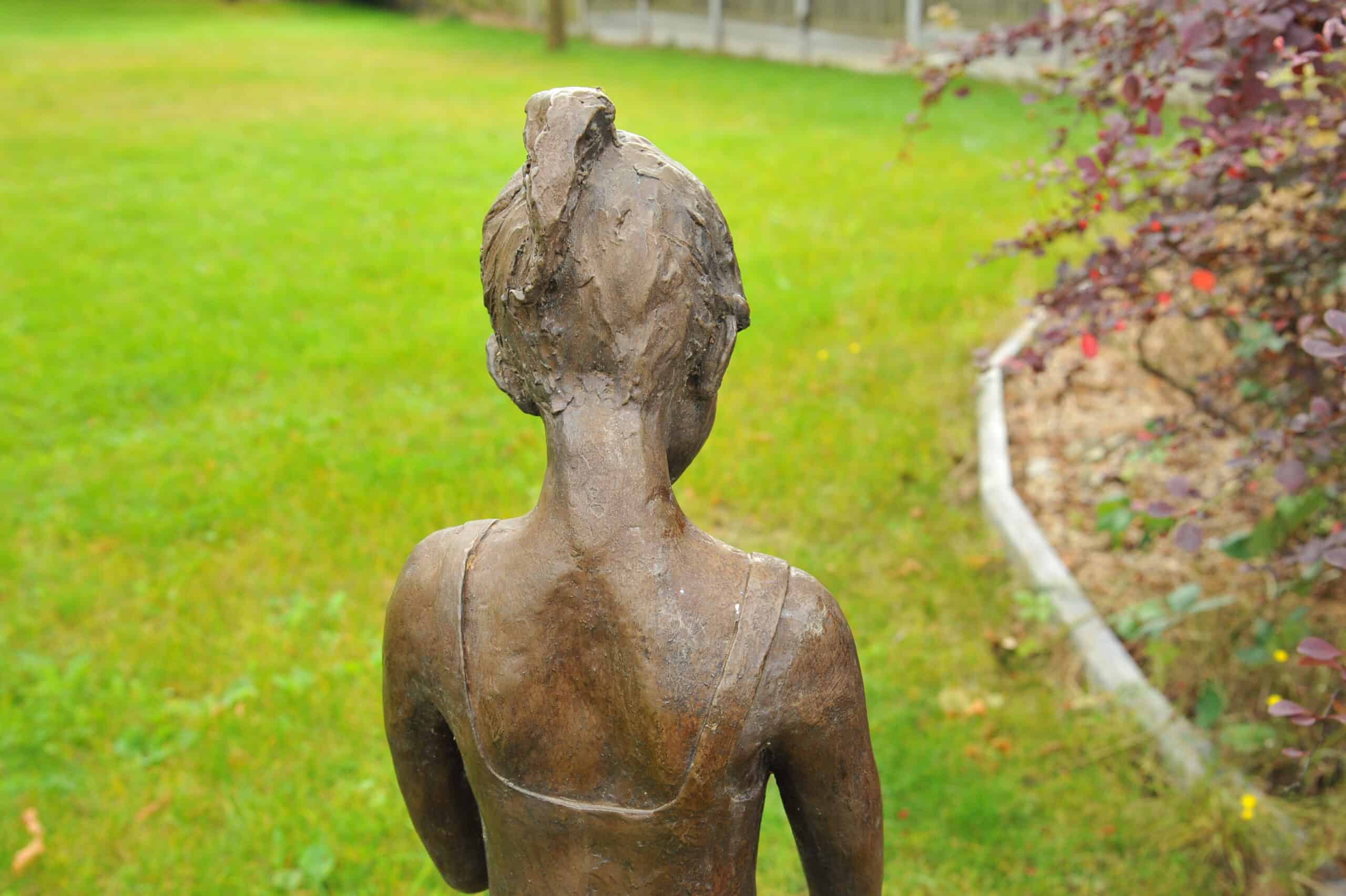 a stunning statue of a young girl