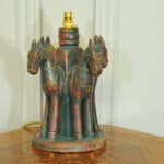 an antique four horse painted table lamp