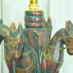 an antique four horse painted table lamp