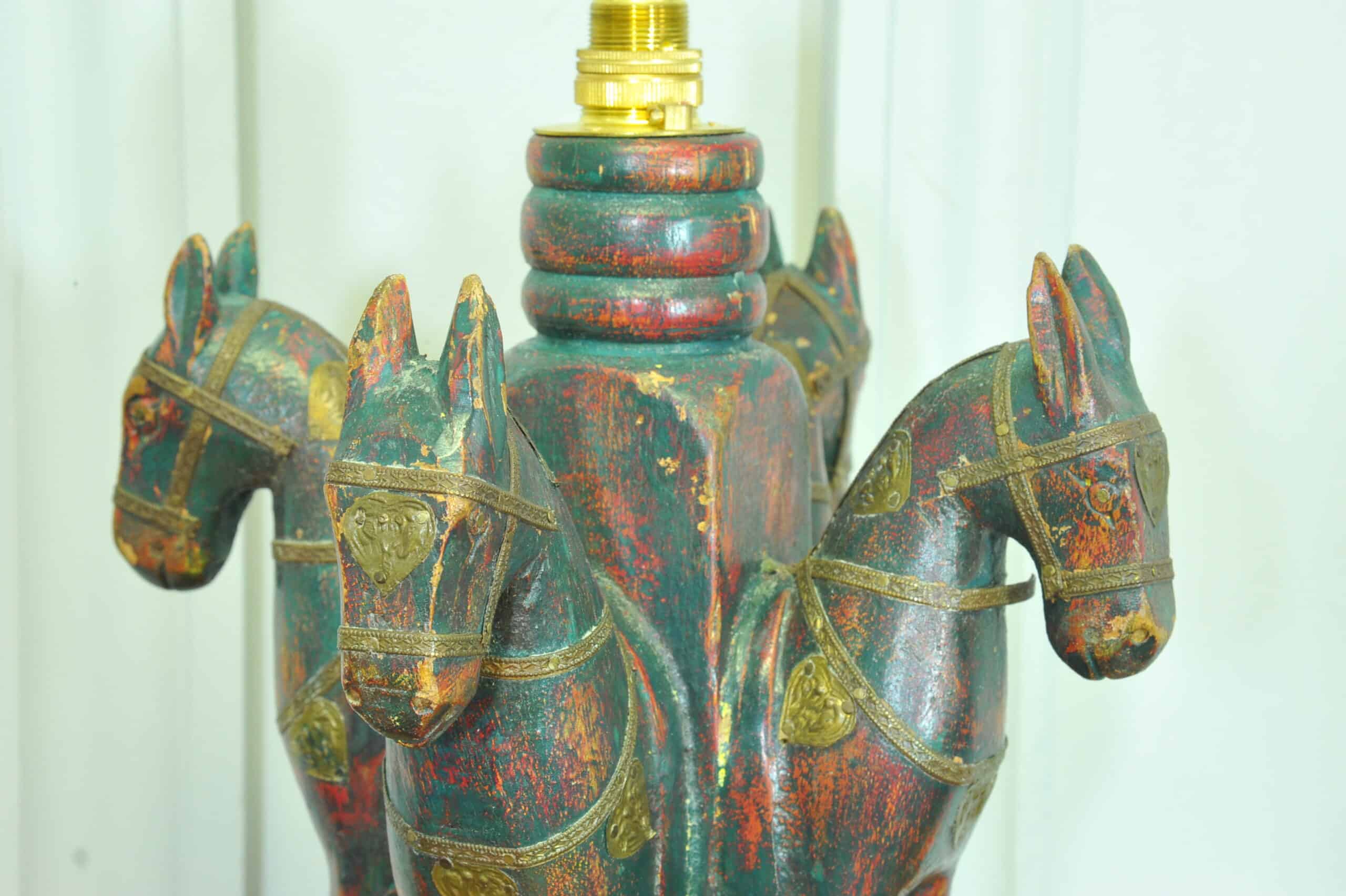 an antique four horse painted table lamp