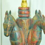 an antique four horse painted table lamp