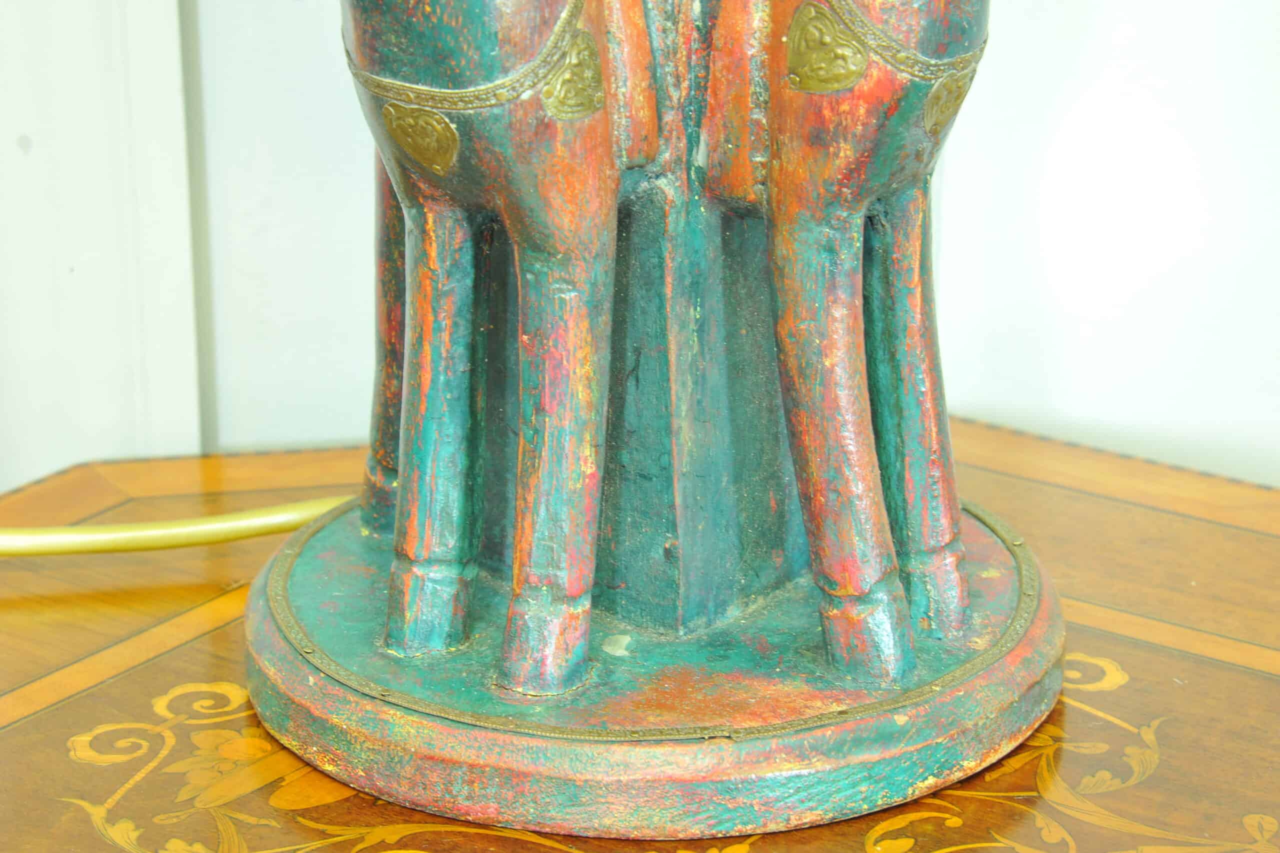 an antique four horse painted table lamp