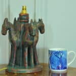 an antique four horse painted table lamp