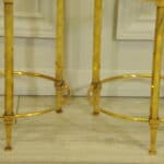 a wonderful pair of vintage maison jansen brass side tables