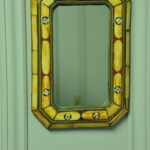 a vintage moroccan bone and brass decorated wall mirror