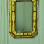 a vintage moroccan bone and brass decorated wall mirror
